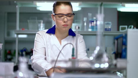 Female-scientist-preparing-for-experiment-in-pharmaceutical-laboratory